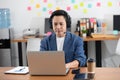 Asian Senior business man wearing earphone meeting with business team via video conference call Royalty Free Stock Photo