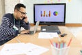 Asian senior business man working online on a modern laptop computer.. Headshot of smiling ceo or manager leaning table with Royalty Free Stock Photo