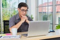 Asian senior business man working online on a modern laptop computer Royalty Free Stock Photo