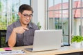 Asian senior business man working online on a modern laptop computer Royalty Free Stock Photo