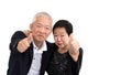 Asian senior couple in business attire showing hand gesture thumb up Royalty Free Stock Photo