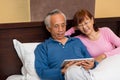 Asian senior couple enjoying in bed Royalty Free Stock Photo