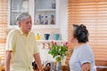 Asian Senior couple husband and wife discussing future plan after retire in kitchen at home .lovely senior couple concept