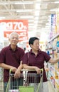 Asian senior couple shopping at supermarket Royalty Free Stock Photo
