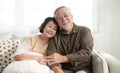 Asian senior couple smiling at the camera. Family mature couple portrait.