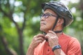 Asian Senior Cyclist man putting Helmet Royalty Free Stock Photo