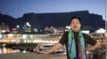 Asian senior elder travel to South Africa Cape town V and A waterfront landmark at night sunset behind table mountain scenic Royalty Free Stock Photo