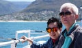 Asian senior elderly couple on tourist ferry boat to seals island trip attracion Fun wildlife watching aticity in South Africa Royalty Free Stock Photo