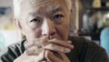 Asian senior elderly man with ring serious thinking and worry ab