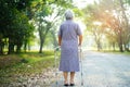 Asian senior or elderly old lady use walker with strong health while walking at park. Royalty Free Stock Photo