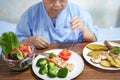 Asian senior or elderly old lady woman patient eating breakfast Royalty Free Stock Photo