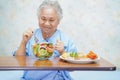 Asian senior or elderly old lady woman patient eating breakfast healthy food Royalty Free Stock Photo