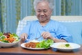 Asian senior or elderly old lady woman patient eating breakfast vegetable healthy food