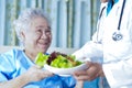 Asian senior or elderly old lady woman patient eating breakfast Royalty Free Stock Photo