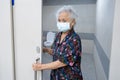 Asian senior elderly old lady woman patient open toilet bathroom by hand in nursing hospital ward, healthy strong medical concept Royalty Free Stock Photo