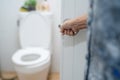 Asian senior elderly old lady woman patient open toilet bathroom by hand in nursing hospital ward, healthy strong medical concept Royalty Free Stock Photo