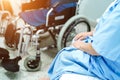 Asian senior or elderly old lady woman patient sitting on bed with wheelchair in nursing hospital ward : healthy strong medical co Royalty Free Stock Photo