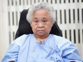 Asian senior or elderly old lady woman patient smile bright face while sitting on wheelchair in nursing hospital ward Royalty Free Stock Photo