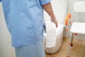 Asian senior elderly old lady woman patient in toilet bathroom with tissue in nursing hospital ward Royalty Free Stock Photo