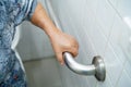 Asian senior or elderly old lady woman patient use toilet bathroom handle security in nursing hospital ward Royalty Free Stock Photo