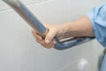 Asian senior or elderly old lady woman patient use toilet bathroom handle security in nursing hospital ward Royalty Free Stock Photo