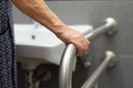 Asian senior or elderly old lady woman patient use toilet bathroom handle security in nursing hospital Royalty Free Stock Photo