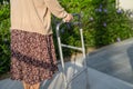 Asian senior or elderly old lady woman patient walk with walker in park with copy space, healthy strong medical concept Royalty Free Stock Photo