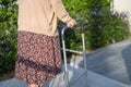 Asian senior or elderly old lady woman patient walk with walker in park with copy space, healthy strong medical concept Royalty Free Stock Photo