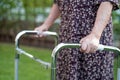 Asian senior or elderly old lady woman patient walk with walker in park,  healthy strong medical concept Royalty Free Stock Photo