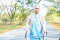 Asian senior or elderly old lady woman patient walk with walker in park : healthy strong medical. Royalty Free Stock Photo