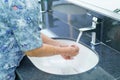 Asian senior elderly old lady woman patient washing hands in toilet bathroom the hospital Royalty Free Stock Photo