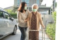 Asian senior or elderly old lady woman walk with walker and wearing a face mask for protect safety infection Covid-19 Coronavirus Royalty Free Stock Photo