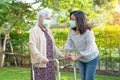 Asian senior or elderly old lady woman walk with walker and wearing a face mask for protect safety infection Covid-19 Coronavirus Royalty Free Stock Photo