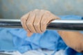 Asian senior or elderly old woman patient lie down handle the rail bed with hope on a bed in the hospital Royalty Free Stock Photo