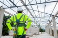 Asian senior engineer technician construction wearing safety harness and safety line working in construction site