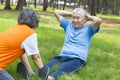 Asian senior grandfather doing sit-ups in the park Royalty Free Stock Photo