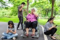 Asian senior grandmother is being ignore from family,elderly bored,sad,frustrated,disregard,parents,child girl with internet,