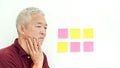 Asian senior man expression worry note paper. copy space Royalty Free Stock Photo