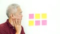 Asian senior man expression worry note paper. copy space Royalty Free Stock Photo