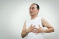 Asian senior man having heart attack Royalty Free Stock Photo