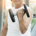 Asian senior man lifting dumbbell in gym. Royalty Free Stock Photo