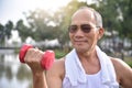 Asian Senior man lifting dumbbell. Royalty Free Stock Photo