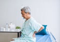 Asian senior man patient pain and backache rest in hospital. Royalty Free Stock Photo