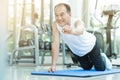 Asian senior man push up at the gym.