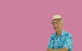 Asian senior man retired elderly in hawaii shirt straw hat happy vacation mode isolated copy space background