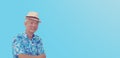 Asian senior man retired elderly in hawaii shirt straw hat happy vacation mode isolated copy space background