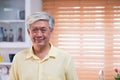 Asian senior man smile in living room at home,Happy aging at home concept Royalty Free Stock Photo