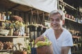 asian senior man toothy smile with happiness face holding succulent plant in hand Royalty Free Stock Photo