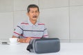 Asian senior man with VR glasses for modern technology. Royalty Free Stock Photo