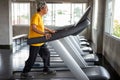 asian Senior man walking exercise on treadmill workout in fitness gym . sport , trainnig , retired , older , mature, elderly Royalty Free Stock Photo